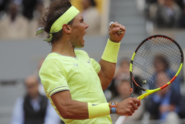 Spain's Rafael Nadal clenches his fist after scoring a point against Switzerland's Roger Federer during their semifinal match of the French Open tennis tournament at the Roland Garros stadium in Paris, Friday, June 7, 2019. (AP Photo/Michel Euler)