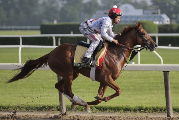 Exercise rider Brian Calo rides Sir Winston during a workout at Belmont Park in Elmont, N.Y., Thursday, June 6, 2019. The 151st Belmont Stakes horse race will be run on Saturday, June 8, 2019. (AP Photo/Seth Wenig)