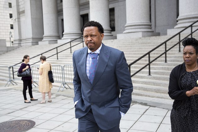 Former Oklahoma State assistant basketball coach Lamont Evans leaves after his sentencing in Federal Court June 7, 2019, in New York. Evans is one of four convicted in a scheme to pay coaches and families of top-tier players to choose favored managers and financial advisors. (AP Photo/Kevin Hagen)