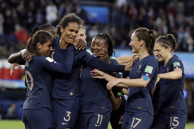 France's Wendie Renard, second from left, celebrates with teammates after scoring her second goal during the Women's World Cup Group A soccer match between France and South Korea at the Parc des Princes in Paris, Friday, June 7, 2019. (AP Photo/Alessandra Tarantino)