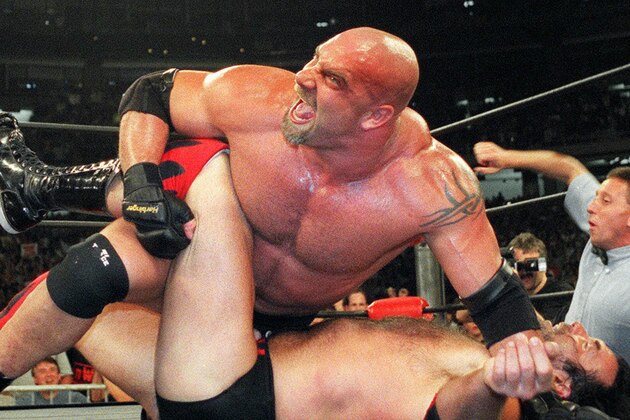 FILE - In this July 6, 1998, file photo, World Championship Wrestling heavyweight champion Bill Goldberg puts Scott Hall to the mat during a match in Atlanta. Bill Goldberg found his toughest tag-team partner yet.
