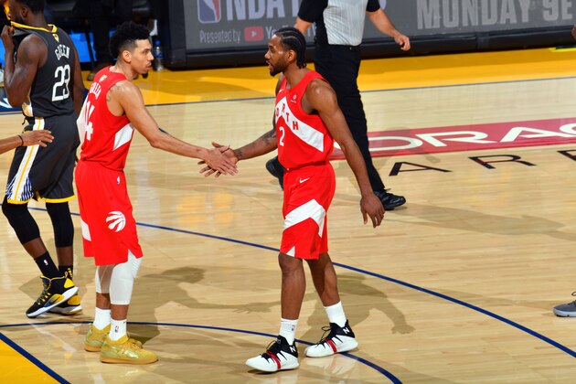 OAKLAND, CA - JUNE 7: Danny Green #14 and Kawhi Leonard #2 of the Toronto Raptors high-five during a game against the Golden State Warriors during Game Four of the NBA Finals on June 7, 2019 at ORACLE Arena in Oakland, California. NOTE TO USER: User expressly acknowledges and agrees that, by downloading and/or using this photograph, user is consenting to the terms and conditions of Getty Images License Agreement. Mandatory Copyright Notice: Copyright 2019 NBAE (Photo by Jesse D. Garrabrant/NBAE via Getty Images)