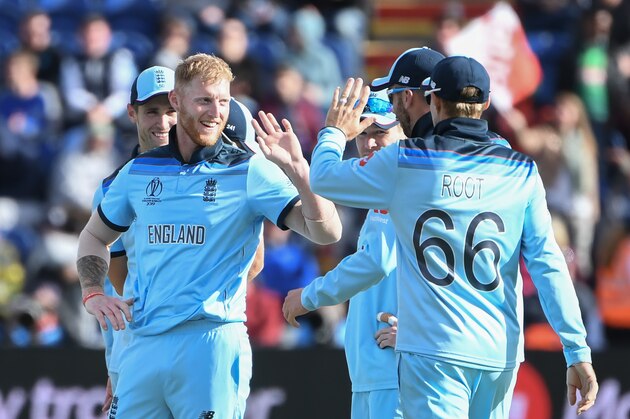 England's Ben Stokes (L) celebrates with teammates after taking the wicket of Bangladesh's Mohammad Saifuddin during the 2019 Cricket World Cup group stage match between England and Bangladesh at Sophia Gardens stadium in Cardiff, south Wales, on June 8, 2019. (Photo by Paul ELLIS / AFP) / RESTRICTED TO EDITORIAL USE        (Photo credit should read PAUL ELLIS/AFP/Getty Images)