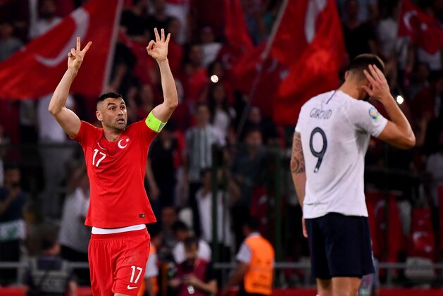 Turkey's forward Burak Yilmaz (L) celebrates after his teammate Turkey's Midfielder Cengiz Under scores his team's second goal during the Euro 2020 football qualification match between Turkey and France at the Buyuksehir Belediyesi stadium in Konya, on June 7, 2019. (Photo by FRANCK FIFE / AFP)        (Photo credit should read FRANCK FIFE/AFP/Getty Images)