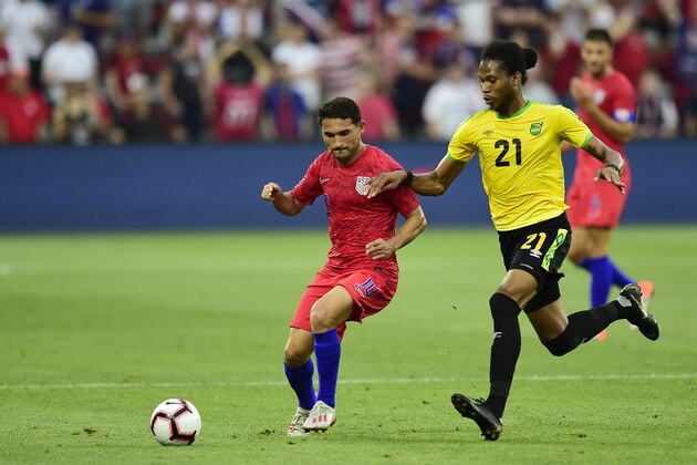 WASHINGTON, DC - JUNE 05: Cristian Roldan #10 of the United States and Kevon Lambert #21 of Jamaica battle for the ball in the first half during an International Friendly at Audi Field on June 5, 2019 in Washington, DC. (Photo by Patrick McDermott/Getty Images)