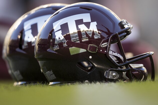 Texas A&M reflective helmets sit on the field before the start of a NCAA college football against Mississippi State on Saturday, Oct. 28, 2017, in College Station, Texas. (AP Photo/Sam Craft)
