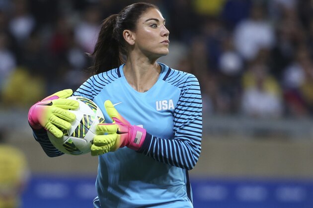 FILE - In this Aug. 3, 2016, file photo, U.S. goalkeeper Hope Solo takes the ball during a women's Olympic football tournament match against New Zealand in Belo Horizonte, Brazil. Solo has been suspended form the team for six months for what U.S. Soccer termed conduct