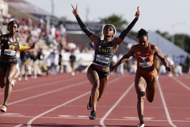 LSU's Sha'Carri Richardson, center, celebrates as she wins the women's 100 meters during the NCAA outdoor track and field championships in Austin, Texas, Saturday, June 8, 2019. (AP Photo/Eric Gay)