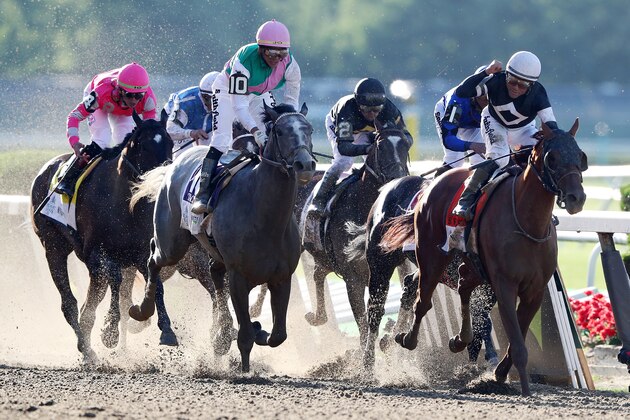 ELMONT, NEW YORK - JUNE 08: Sir Winston with Joel Rosario celebrates after winning the Belmont Stakes during the 151th running of the Belmont Stakes at Belmont Park on June 08, 2019 in Elmont, New York. (Photo by Mike Stobe/Getty Images)