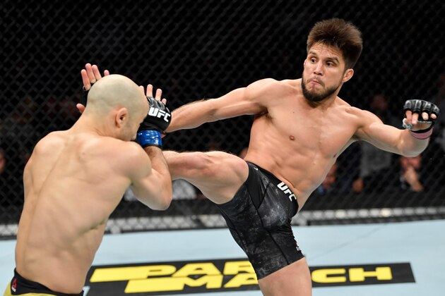 CHICAGO, IL - JUNE 08:  (R-L) Henry Cejudo kicks Marlon Moraes of Brazil in their bantamweight championship bout during the UFC 238 event at the United Center on June 8, 2019 in Chicago, Illinois. (Photo by Jeff Bottari/Zuffa LLC/Zuffa LLC via Getty Images)