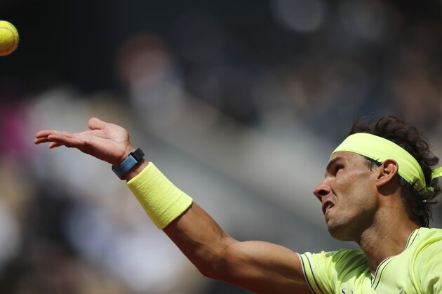 Spain's Rafael Nadal serves against Switzerland's Roger Federer during their semifinal match of the French Open tennis tournament at the Roland Garros stadium in Paris, Friday, June 7, 2019. (AP Photo/Christophe Ena)