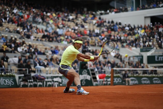 Spain's Rafael Nadal plays a shot against Switzerland's Roger Federer during their semifinal match of the French Open tennis tournament at the Roland Garros stadium in Paris, Friday, June 7, 2019. (AP Photo/Christophe Ena)
