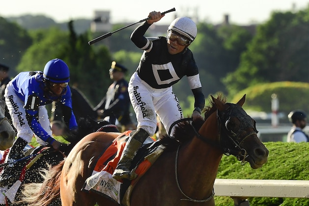 Jockey Joel Rosario reacts atop Sir Winston (7) after winning the 151st running of the Belmont Stakes horse race , Saturday, June 8, 2019, in Elmont, N.Y. (AP Photo/Steven Ryan)