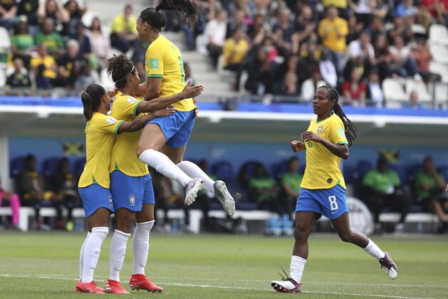 Brazil's Cristiane, second from left, celebrates with her teammates after scoring her side's opening goal during the Women's World Cup Group C soccer match between Brazil and Jamaica in Grenoble, France, Sunday, June 9, 2019. (AP Photo/Laurent Cipriani)