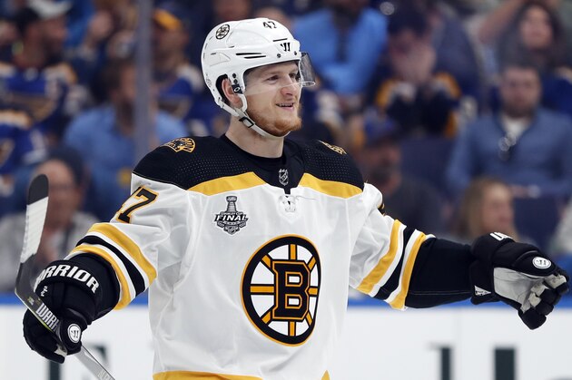 Boston Bruins defenseman Torey Krug celebrates a teammate's goal against the St. Louis Blues during the first period of Game 3 of the NHL hockey Stanley Cup Final Saturday, June 1, 2019, in St. Louis. (AP Photo/Jeff Roberson)