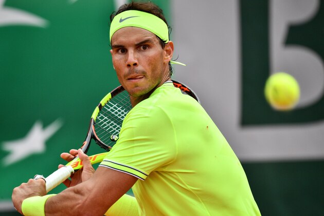 Spain's Rafael Nadal returns the ball to Austria's Dominic Thiem during their men's singles final match, on day fifteen of The Roland Garros 2019 French Open tennis tournament in Paris on June 9, 2019. (Photo by Martin BUREAU / AFP)        (Photo credit should read MARTIN BUREAU/AFP/Getty Images)