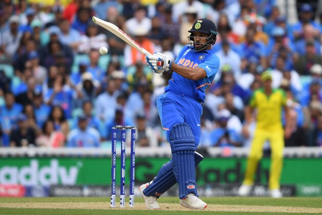 India's Shikhar Dhawan plays a shot during the 2019 Cricket World Cup group stage match between India and Australia at The Oval in London on June 9, 2019. (Photo by Dibyangshu SARKAR / AFP) / RESTRICTED TO EDITORIAL USE        (Photo credit should read DIBYANGSHU SARKAR/AFP/Getty Images)