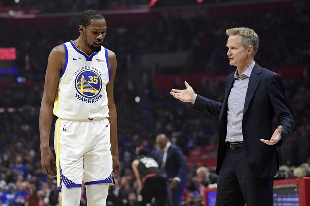 Golden State Warriors coach Steve Kerr, right, talks to forward Kevin Durant during the first half in Game 3 of the team's first-round NBA basketball playoff series against the Los Angeles Clippers on Thursday, April 18, 2019, in Los Angeles. (AP Photo/Mark J. Terrill)