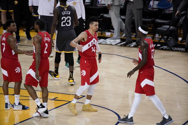 Toronto Raptors' Kyle Lowry, from left, celebrates with Kawhi Leonard, Danny Green and Pascal Siakam during the second half of Game 4 of basketball's NBA Finals against the Golden State Warriors in Oakland, Calif., Friday, June 7, 2019. (AP Photo/Tony Avelar)