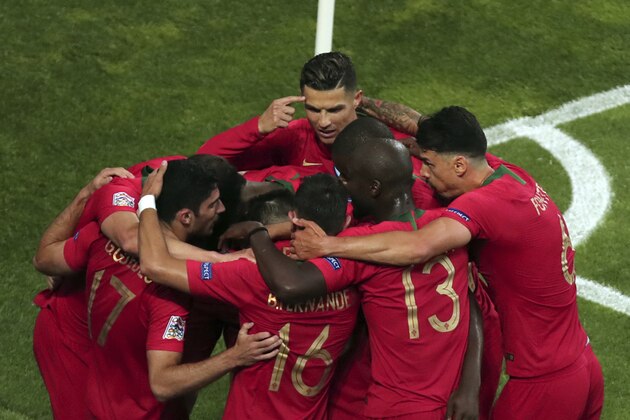Portugal's Goncalo Guedes celebrates with teammates after scoring his side's opening goal during the UEFA Nations League final soccer match between Portugal and Netherlands at the Dragao stadium in Porto, Portugal, Sunday, June 9, 2019. (AP Photo/Luis Vieira)