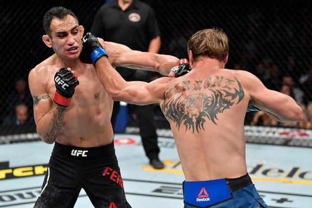CHICAGO, IL - JUNE 08:  (L-R) Tony Ferguson and Donald Cerrone exchange punches in their lightweight bout during the UFC 238 event at the United Center on June 8, 2019 in Chicago, Illinois. (Photo by Jeff Bottari/Zuffa LLC/Zuffa LLC via Getty Images)