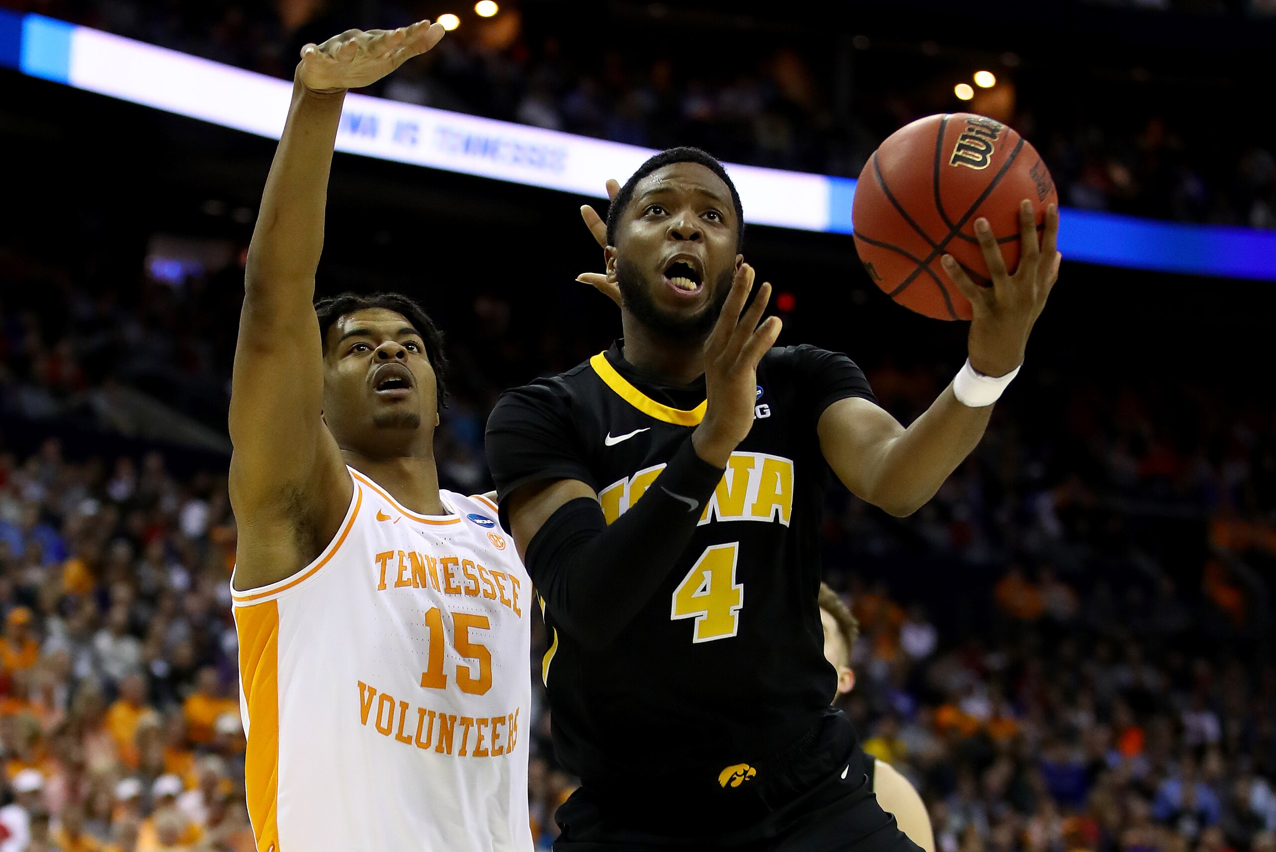 COLUMBUS, OHIO - MARCH 24:  Isaiah Moss #4 of the Iowa Hawkeyes goes up for a shot against Derrick Walker #15 of the Tennessee Volunteers during their game in the Second Round of the NCAA Basketball Tournament at Nationwide Arena on March 24, 2019 in Columbus, Ohio. (Photo by Gregory Shamus/Getty Images)