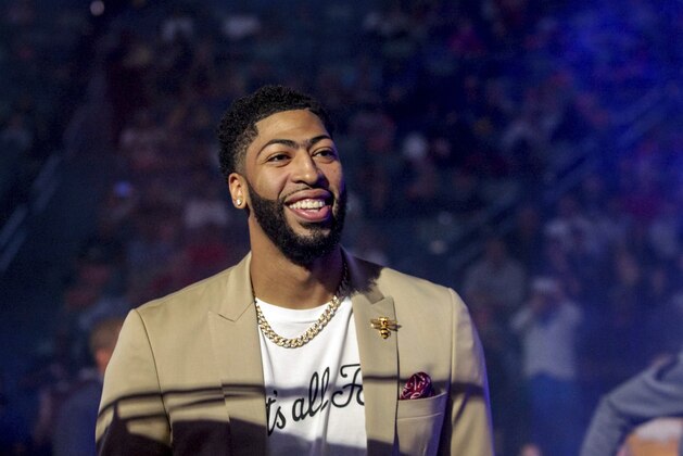 New Orleans Pelicans forward Anthony Davis (23) wears a T-shirt with 'That's All, Folks,' printed on it during player introduction before an NBA basketball game between the New Orleans Pelicans and the Golden State Warriors in New Orleans, Tuesday, April 9, 2019. (AP Photo/Scott Threlkeld)