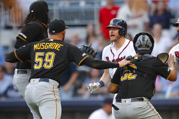 ATLANTA, GA - JUNE 10: Josh Donaldson #20 of the Atlanta Braves is restrained after being hit by a pitch as he charges Joe Musgrove #59 of the Pittsburgh Pirates during the first inning of an MLB game at SunTrust Park on June 10, 2019 in Atlanta, Georgia. (Photo by Todd Kirkland/Getty Images) ATLANTA, GA - JUNE 10: Josh Donaldson #20 of the Atlanta Braves is restrained after being hit by a pitch as he charges Joe Musgrove #59 of the Pittsburgh Pirates during the first inning of an MLB game at SunTrust Park on June 10, 2019 in Atlanta, Georgia. (Photo by Todd Kirkland/Getty Images)