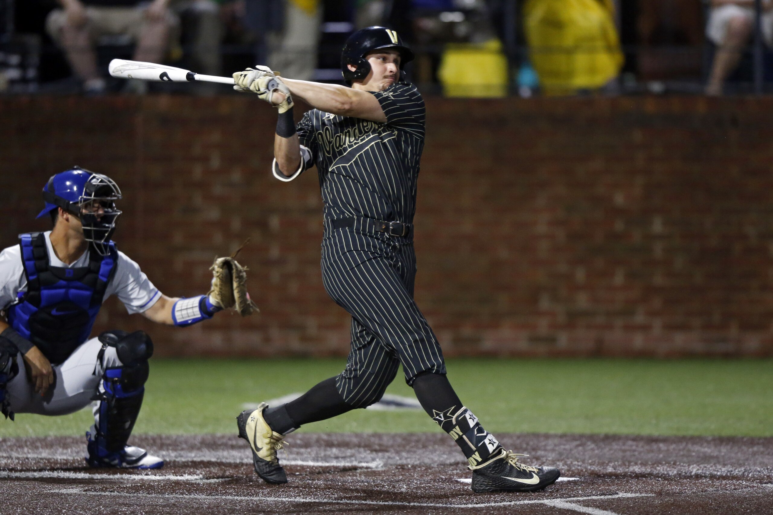 Vanderbilt's JJ Bleday follows through on a hit during the second inning of the team's NCAA college super regional baseball game against Duke on Friday, June 7, 2019, in Nashville, Tenn. (AP Photo/Wade Payne)