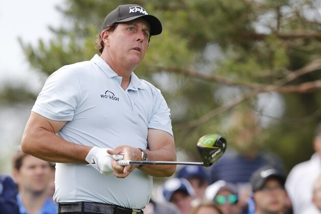 Phil Mickelson watches his tee shot on the 11th hole during the second round of the Memorial golf tournament Friday, May 31, 2019, in Dublin, Ohio. (AP Photo/Jay LaPrete)