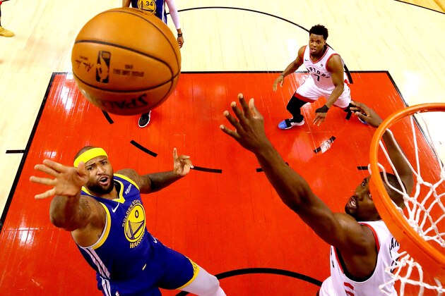 TORONTO, ONTARIO - JUNE 10:  DeMarcus Cousins #0 of the Golden State Warriors attempts a shot Serge Ibaka #9 of the Toronto Raptors during Game Five of the 2019 NBA Finals at Scotiabank Arena on June 10, 2019 in Toronto, Canada. NOTE TO USER: User expressly acknowledges and agrees that, by downloading and or using this photograph, User is consenting to the terms and conditions of the Getty Images License Agreement. (Photo by Gregory Shamus/Getty Images)