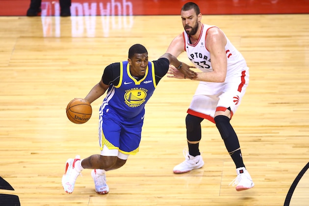 TORONTO, ONTARIO - JUNE 10:  Kevon Looney #5 of the Golden State Warriors is defended by Marc Gasol #33 of the Toronto Raptors in the first half during Game Five of the 2019 NBA Finals at Scotiabank Arena on June 10, 2019 in Toronto, Canada. NOTE TO USER: User expressly acknowledges and agrees that, by downloading and or using this photograph, User is consenting to the terms and conditions of the Getty Images License Agreement. (Photo by Vaughn Ridley/Getty Images)