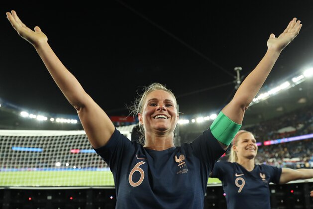 PARIS, FRANCE - JUNE 07: Amandine Henry and Eugenie Le Sommer of France celebrate with the fans following the 2019 FIFA Women's World Cup France group A match between France and Korea Republic at Parc des Princes on June 07, 2019 in Paris, France. (Photo by Richard Heathcote/Getty Images)