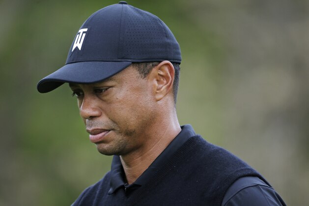Tiger Woods walks off the seventh tee during the second round of the PGA Championship golf tournament, Friday, May 17, 2019, at Bethpage Black in Farmingdale, N.Y. (AP Photo/Seth Wenig)