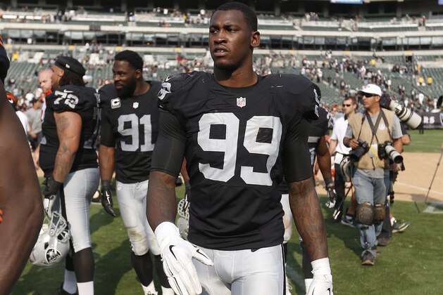 Oakland Raiders linebacker Aldon Smith (99) walks off the field after an NFL football game against the Cincinnati Bengals in Oakland, Calif., Sunday, Sept. 13, 2015. (AP Photo/Tony Avelar)