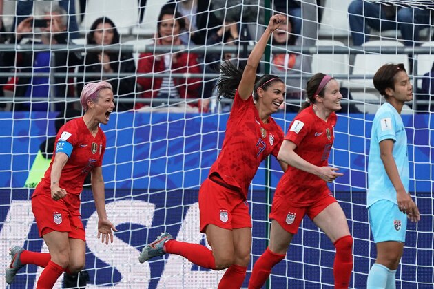 United States' forward Alex Morgan (C) celebrates after scoring the opening goal during the France 2019 Women's World Cup Group F football match between USA and Thailand, on June 11, 2019, at the Auguste-Delaune Stadium in Reims, eastern France. (Photo by Lionel BONAVENTURE / AFP)        (Photo credit should read LIONEL BONAVENTURE/AFP/Getty Images)