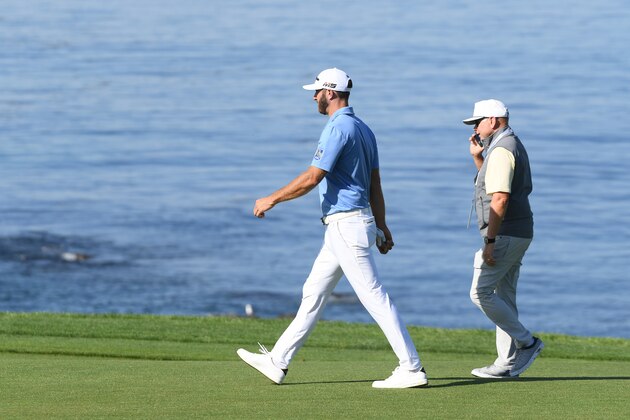 PEBBLE BEACH, CALIFORNIA - JUNE 11: Dustin Johnson of the United States (L) and player manager, David Winkle, walk off during a practice round prior to the 2019 U.S. Open at Pebble Beach Golf Links on June 11, 2019 in Pebble Beach, California. (Photo by Harry How/Getty Images)