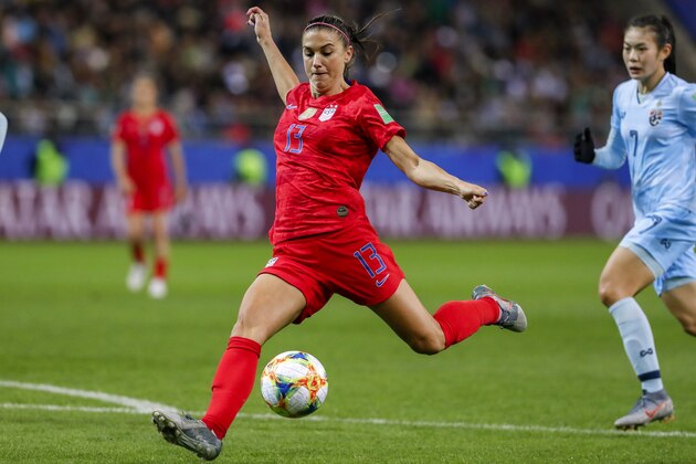 REIMS, FRANCE - JUNE 11: Alex Morgan #13 of USA scores her fifth goal, record tie, during the 2019 FIFA Women's World Cup France group F match between USA and Thailand at Stade Auguste Delaune on June 11, 2019 in Reims, France. (Photo by Catherine Steenkeste/Getty Images)