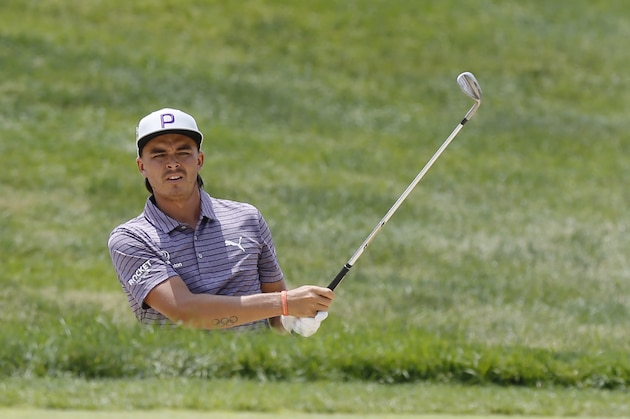 Rickie Fowler hits from the sand on the first hole during the third round of the Memorial golf tournament Saturday, June 1, 2019, in Dublin, Ohio. (AP Photo/Jay LaPrete)