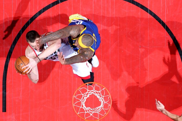 TORONTO, CANADA - JUNE 10: Marc Gasol #33 of the Toronto Raptors shoots the ball against DeMarcus Cousins #0 of the Golden State Warriors during Game Five  of the NBA Finals on June 10, 2019 at Scotiabank Arena in Toronto, Ontario, Canada. NOTE TO USER: User expressly acknowledges and agrees that, by downloading and/or using this photograph, user is consenting to the terms and conditions of the Getty Images License Agreement. Mandatory Copyright Notice: Copyright 2019 NBAE (Photo by Nathaniel S. Butler/NBAE via Getty Images)
