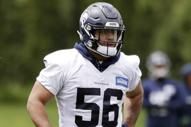 Seattle Seahawks' Mychal Kendricks stands on the field during an NFL football practice Tuesday, May 21, 2019, in Renton, Wash. (AP Photo/Elaine Thompson)