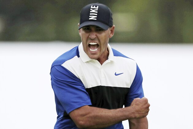 Brooks Koepka reacts after sinking a putt on the 18th green to win the PGA Championship golf tournament, Sunday, May 19, 2019, at Bethpage Black in Farmingdale, N.Y. (AP Photo/Charles Krupa)