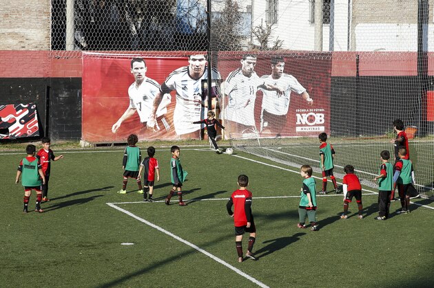 Kids play football at Newell's Old Boys' Malvinas Sports Complex
