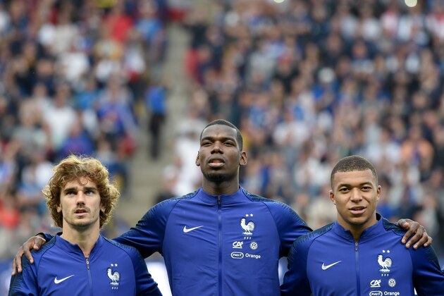 France's forward Antoine Griezmann (L) France's midfielder Paul Pogba (C) and France's forward Kylian Mbappe observes their national anthem before the friendly match between France and Bolivia at La Beaujoire stadium in Nantes, Western France on June 2, 2019. (Photo by Sebastien SALOM-GOMIS / AFP)        (Photo credit should read SEBASTIEN SALOM-GOMIS/AFP/Getty Images)