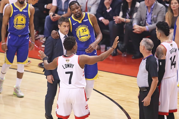 TORONTO,ONTARIO - JUNE 10:  Kyle Lowry #7 of the Toronto Raptors tries to get the crowd to appreciate an injured Kevin Durant #35 of the Golden State Warriors during Game Five of the 2019 NBA Finals at Scotiabank Arena on June 10, 2019 in Toronto, Canada. NOTE TO USER: User expressly acknowledges and agrees that, by downloading and or using this photograph, User is consenting to the terms and conditions of the Getty Images License Agreement. (Photo by Claus Andersen/Getty Images)