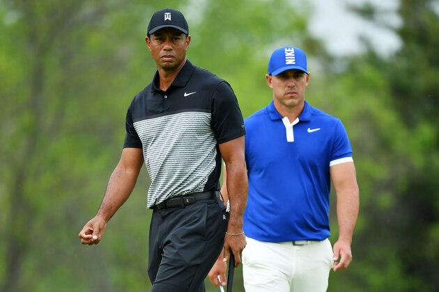 FARMINGDALE, NEW YORK - MAY 17: Tiger Woods of the United States and Brooks Koepka of the United States walk along the course during the second round of the 2019 PGA Championship at the Bethpage Black course on May 17, 2019 in Farmingdale, New York. (Photo by Stuart Franklin/Getty Images)