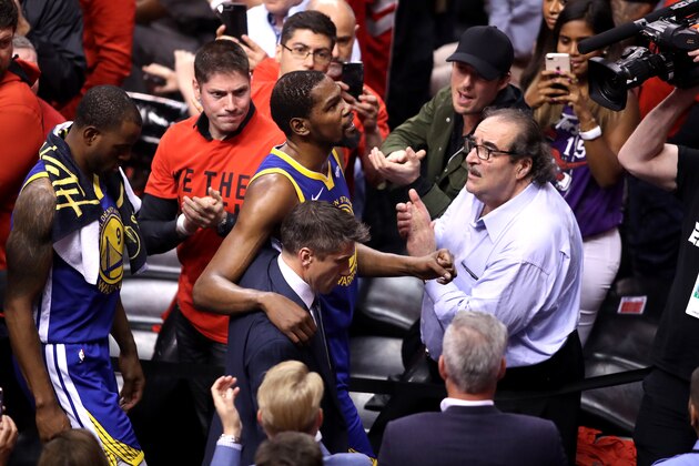 TORONTO, ONTARIO - JUNE 10:  Kevin Durant #35 of the Golden State Warriors is assisted off the court after sustaining an injury in the first half against the Toronto Raptors during Game Five of the 2019 NBA Finals at Scotiabank Arena on June 10, 2019 in Toronto, Canada. NOTE TO USER: User expressly acknowledges and agrees that, by downloading and or using this photograph, User is consenting to the terms and conditions of the Getty Images License Agreement. (Photo by Claus Andersen/Getty Images)