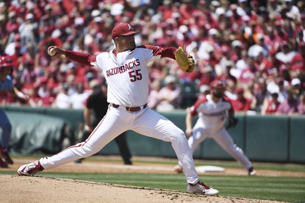 Arkansas' Isaiah Campbell throws against Mississippi during the second inning of Game 1 at the NCAA college baseball super regional tournament Saturday, June 8, 2019, 2019, in Fayetteville, Ark. (AP Photo/Michael Woods)