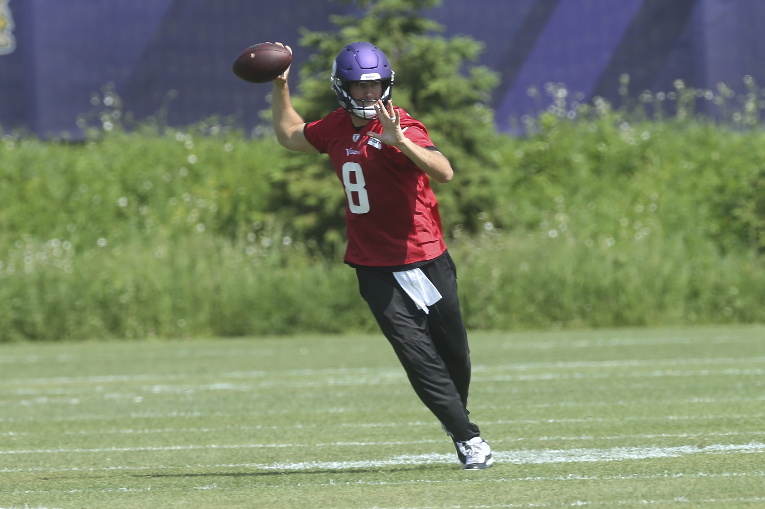 Minnesota Vikings quarterback Kirk Cousins goes through a drill during the NFL football team workouts Tuesday, June 4, 2019, in Eagan, Minn. (AP Photo/Jim Mone)