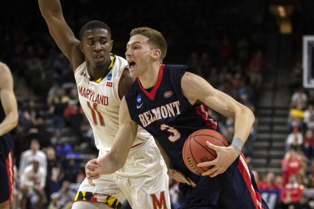 Belmont guard Dylan Windler (3) drives to the basket while being defended by Maryland guard Darryl Morsell (11) during the second half of the first round men's college basketball game in the NCAA Tournament, in Jacksonville, Fla. Thursday, March 21, 2019. (AP Photo/Stephen B. Morton)